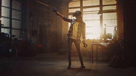 Talented Female Artist Wearing Virtual Reality Headset and Holding Digital Joysticks. Shes Working...