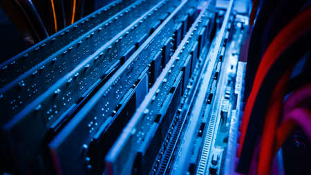 Close-up Macro Shot: Inside of the Computer Case. PCB Motherboard with Multiple Slots with RAM...