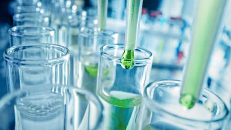 Pharmaceutics Laboratory: Multiple Pipettes Dropping Yellow Liquid into Test Tubes, Medical Research...