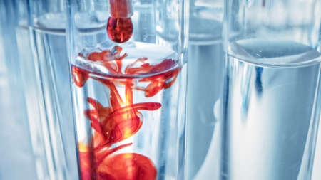 Pipette Dropping Blood into Test Tubes, Blood Test, and Analysis in Medical Research Laboratory....