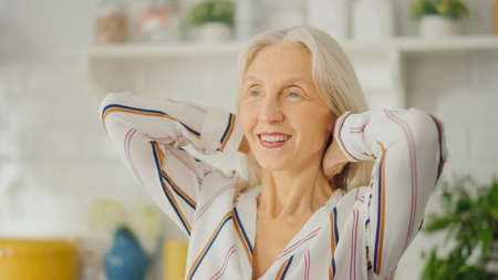 Authentic Portrait Shot of Senior Female Pensioner in a Bright Room at Home. Beautiful Old Female...