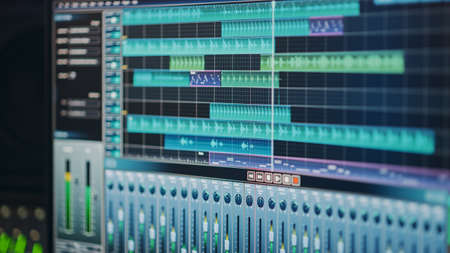 Modern Music Recording Studio Equipment: Computer Screen Showing User Interface of DAW Digital Audio...