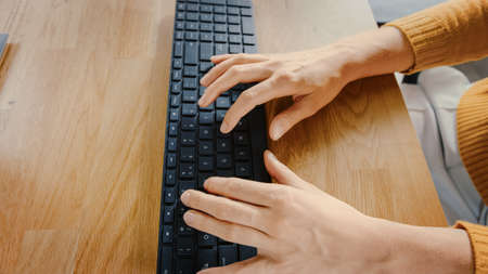 Top View Close-up Shot of a Female Hands Typing on a Keyboard. Beautiful Young Female Specialist...