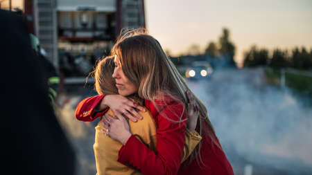Car Crash Traffic Accident: Injured Young Girl Reunites with Her Loving Mother. In the Background...