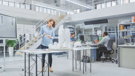 In Architectural Bureau: Team of Architects and Engineers Working on a Building Complex Prototype...