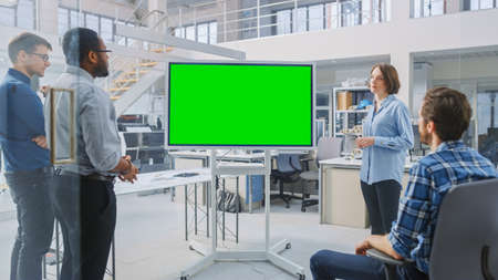 In the In Industrial Design Facility Team of Engineers and Technicians have a Meeting, Female...