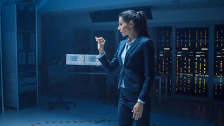 In Modern Data Center Research Laboratory Beautiful Confident Woman Does Virtual Reality Activating...