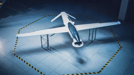 Elevated Shot of an Unmanned Aerial Vehicle Drone Prototype. Industrial Facility with Aircraft...