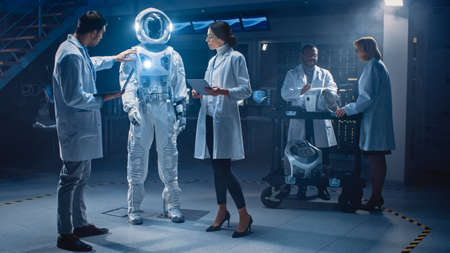 Team of Aerospace Engineers Design New Space Suit Adapted for Galaxy Exploration and Travel. Group...