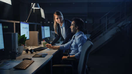Ambitious Businessman Uses Desktop Computer, His Female Project Manager Explains Specific Tasks,...