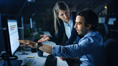 Confident Businessman Uses Desktop Computer, His Female Manager Explains Specific Tasks, Account...