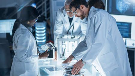In Technology Research Laboratory: Diverse Team of Industrial Scientists, Engineers, Developers Work...
