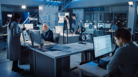 Diverse International Team of Industrial Engineers and Scientists Working in Research Laboratory...