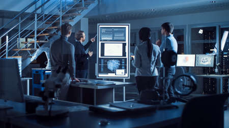 Project Manager Does Motivational Presentation or Team of Electronics Development Engineers, he Uses...