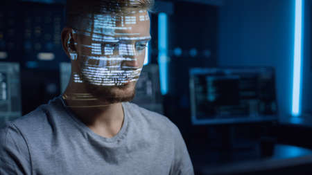 Handsome Young Software Developer Working on Personal Computer in Digital Identity Cyber Security...