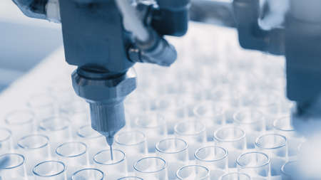 Close-up Shot of the Industrial Manufacturing Medical Test Tubes, Process of Sterilising and Filling...