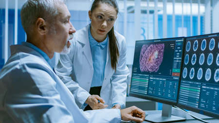 Two Medical Scientists in the Brain Research Laboratory Discussing Progress on the Neurophysiology...