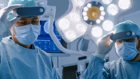 Surgeons Remove Augmented Reality Glasses after Performing State of the Art Surgery in High Tech...