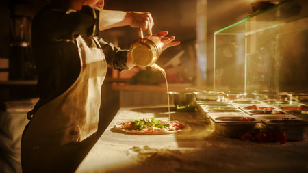 In Restaurant Professional Female Chef Preparing Pizza, Adding Ingredients, Special Sauce, Cheese. Cooking by Traditional Family Recipe. Authentic Sunny Italian Pizzeria withの写真素材