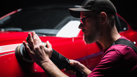 Portrait of an Adult Man Working in a Detailing Studio, Prepping a Factory Fresh American Sportscar...