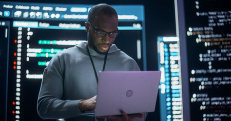 Portrait of Professional Programmer Developing a Big Data Interface Software Project.Young Black Man...