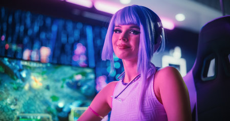 Portrait of a Stylish Cyberpunk Cosplay Content Creator with Blue Hair Posing in Front of Camera, Smiling. Young Happy Beautiful Gamer Girl Looking at Camera in aの写真素材