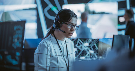 Portrait of a Female Fleet Operator Working in an Office Hub for Order Delivery, Control and Client...