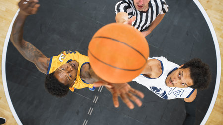 Basketball Tournament Final: Diverse Yellow and White Teams Compete at Center Court for Jump Ball...