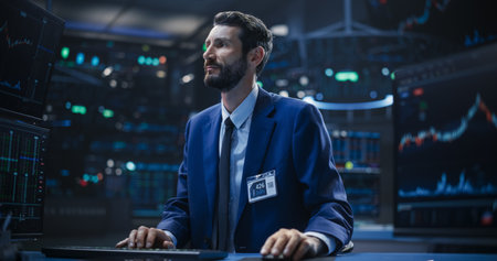 Adult Stock Exchange Broker Working on a Desktop Computer with Real-Time Stock Information,...