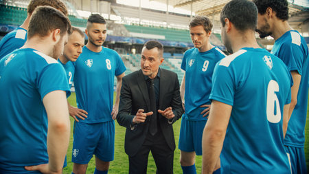 Professional Soccer Team Training, Tactical Coaching: Football Coach Explains Game Strategy, Develop Workout Plan Trainer Motivates Athletes, Leads to Victory,の写真素材