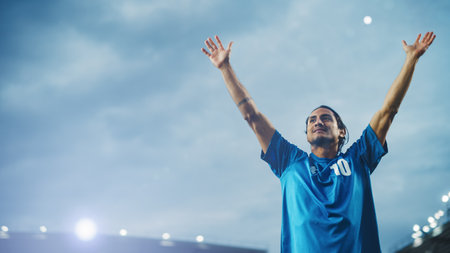 Football Match Championship: Portrait of Soccer Player Standing, Posing, Smiling, Raising Hands to Cheer. Professional Hispanic Footballer, Champion Ready to Win Cup,の写真素材