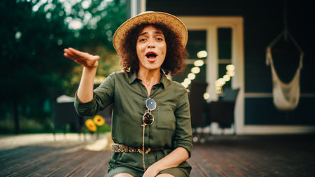 Portrait of a Beautiful Multiethnic Female Dancing and Having Fun on a Porch of a Residential Home....