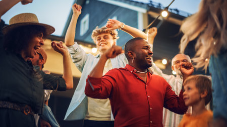 Parents, Children and Multicultural Friends Dancing Together at a Garden Party Disco Event at Home. Young and Senior People Relaxing, Having Fun onの写真素材