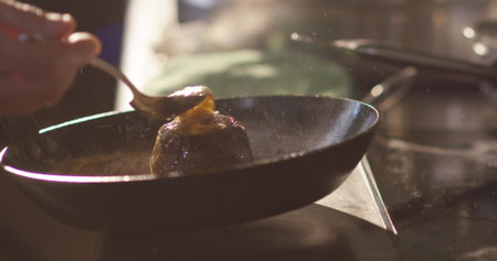 Chef cooking in a restaurant kitchen, Chef preparing food in a panの写真素材