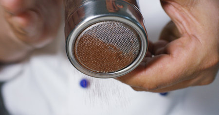 Close-up of a man pouring coffee from a shaker.の写真素材