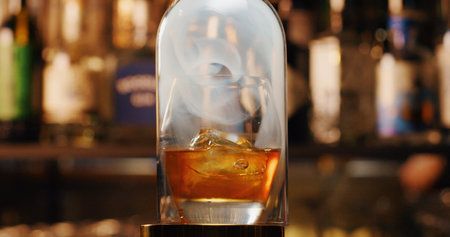 Whiskey on the rocks with ice in a glass decanterの写真素材