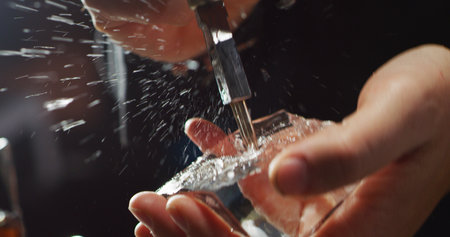 Male bartender Drilling Iceの写真素材