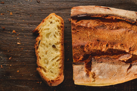 Ciabatta bread on rustic wooden background, top view