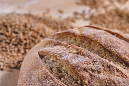 Freshly baked bread on a wooden board. Selective focus.