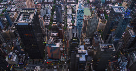 Top Down Aerial View of New York City Streets with Old Residential Buildings Contrasting with Modern Skyscrapers and Construction Sites. Busy Urban Center Cars, Yellow Taxis and Commercial Vehiclesの写真素材