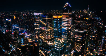 Aerial View of Midtown Manhattan Architecture at Night. Evening Shot of Financial Business District from a Helicopter. Scenery of Historic Office Towers and Residential Buildingsの写真素材