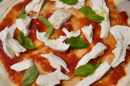 Pizza with mozzarella cheese and basil, close-up