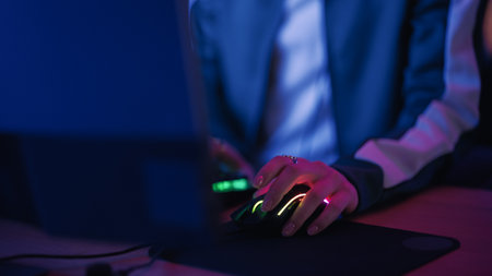 Excited Female Gamer Playing Online Video Game on Computer. Close Up of Young Woman's Hands on...