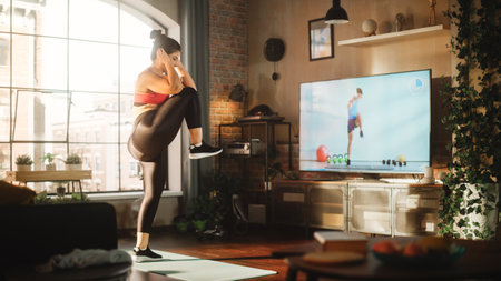 Home Training: Magnificent Plus Size Body Positive Girl Training with Personal Trainer via Online Video Tutorial. Authentic Woman Using Workout Service Fitness Streaming App for Virtual Trainingの写真素材