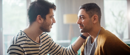 Authentic Close Up Shot of a Stylish Handsome Young Adult Gay Couple Spend Time at Home. Two Happy Men in Love in Casual Clothes Make a Gentle Headbutt. Cute LGBT Relationship Content.の写真素材