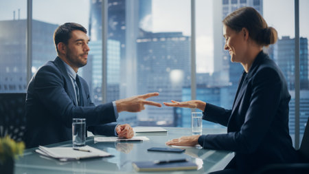 Female and Male Business Partners Have Fun and Play Rock Paper Scissors while Meeting Discussing Corporate Strategy, Financial Reports and Marketing Projects. Corporate Decisions Rely on Chance.の写真素材