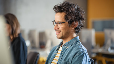 Portrait of a Handsome Smart Male Student, Studying in University, Fondly Smiling. He Wears Glasses...