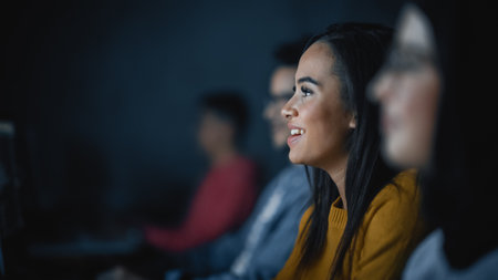 Diverse Multiethnic Group of Female and Male Students Sitting in College Room, Collaborating on...