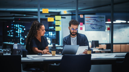 Businesspeople in Modern Office: Business Meeting of Two Managers. Female CEO and Marketing Director Talk, Brainstorm Corporate Strategy, Implementing Marketing and Financial Plans. Evening Time.の写真素材
