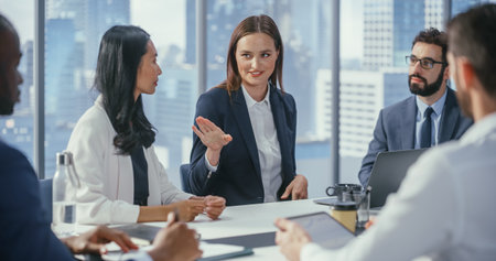 Modern Multi-Ethnic Office Conference Room Meeting: Ambitious Beautiful Caucasian Businesswoman...